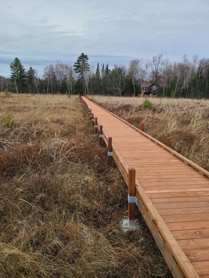 A straight Custom Boardwalk through a wetland